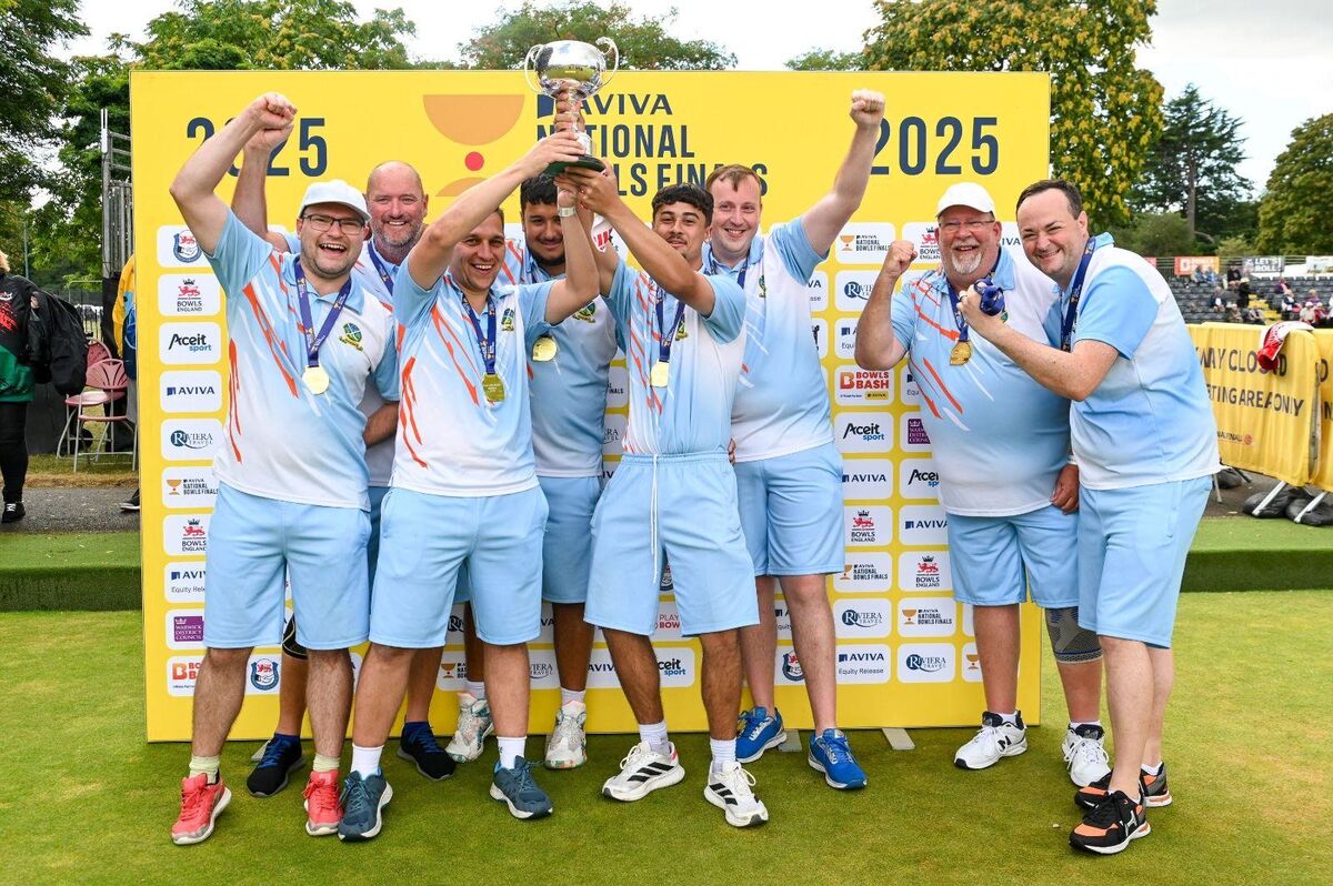 The winning Club Two Fours team lifting the trophy at the 2025 Aviva National Bowls Finals